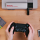Image for article titled Wireless Adapter Lets You Use a PS4 Controller on Your Classic 8-Bit NES Console